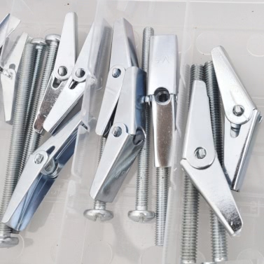 Surtido de tornillos de fiador con resorte para anclaje en yeso 18 uds